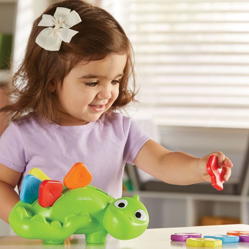 картинка Развивающая игрушка "Стегозаврик" от магазина снабжение школ